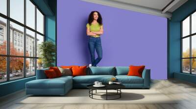 Photo of charming cheerful woman wear stylish clothes hold gift box empty space isolated on purple color background Wall mural