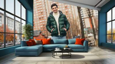 Photo of cheerful handsome man wearing trendy clothes cold autumn season weather outdoors Wall mural