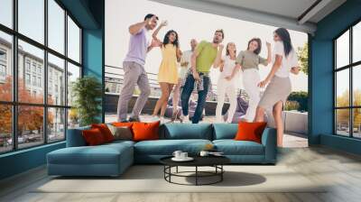 Photo of chilling pretty girls handsome guys have fun dancing party on roof terrace outside Wall mural