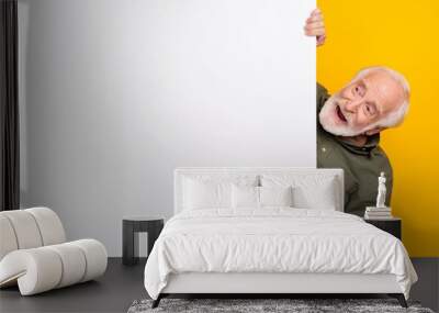 Photo of cool aged white hairdo man look promo wear khaki outfit isolated on yellow color background Wall mural