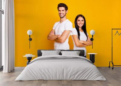 Photo of cool pair lady and guy working together beat partners crossing arms wear casual outfit isolated yellow color background Wall mural