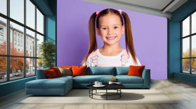 Photo of cute happy brunette little girl charming smile good mood isolated on purple color background Wall mural