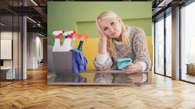 Photo of exhausted pretty aged woman cleaning rug detergent living room apartment indoors Wall mural