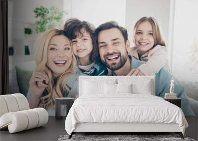 Photo of four family members after adoption having best time rejoicing sit couch living room indoors Wall mural