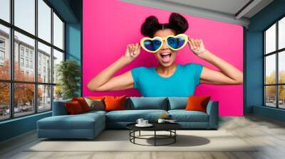 Photo of funky dark skin lady two buns chilling cool students party summer time good mood wear heart shape sun specs blue casual t-shirt isolated magenta color background Wall mural