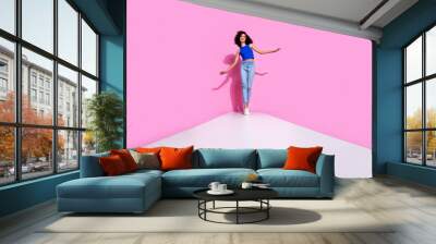 Photo of girl walking on white road path isolated pink color background Wall mural