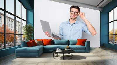 Photo of good mood cheerful smart intelligent attractive student having finished working on presentation to university holding computer isolated over grey color background Wall mural