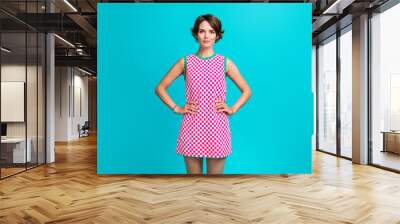 Photo of lovely positive lovely girl wear checkered saran working home cleaning house isolated on cyan color background Wall mural