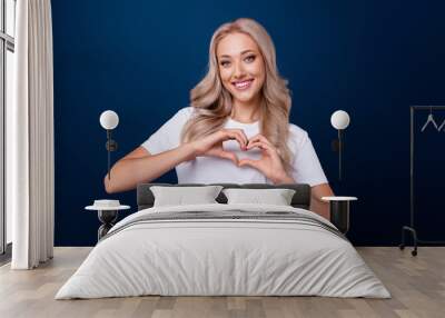 Photo of lovely pretty girl dressed trendy white clothes two arms demonstrate heart symbol isolated on dark blue color background Wall mural