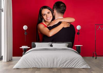 Photo of optimistic couple dance hug wear suit dress isolated on red color background Wall mural