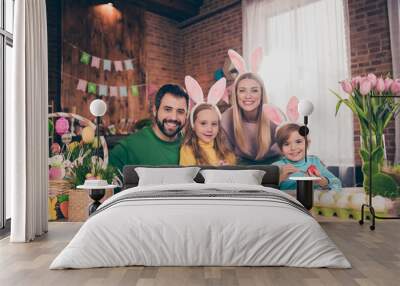 Photo of positive cheerful four people enjoy paint eggs prepare easter basket house indoors Wall mural