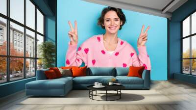 Photo of pretty nice sweet girl dressed stylish clothes show two arm v-sign celebrate seasonal discount isolated on blue color background Wall mural