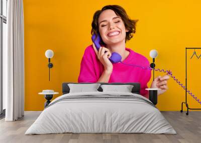 Photo of satisfied girl call telephone wear good mood pullover isolated over shine color background Wall mural