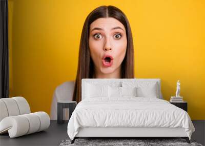 Photo of shocked frightened person open mouth staring camera cant believe isolated on yellow color background Wall mural