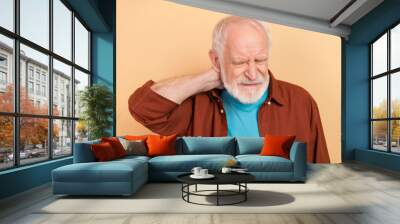 Photo of sick elder white hairdo man palm neck wear outfit isolated on beige color background Wall mural