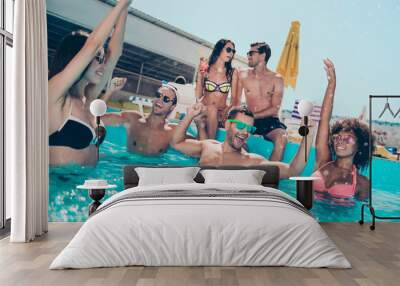 Photo of six multinational friends hanging out in water enjoying best company and pool discotheque Wall mural