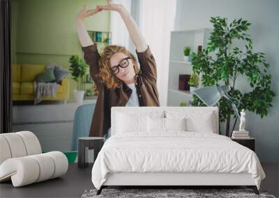 Photo of sleepy exhausted lovely girl wear shirt sit table education from home indoors workplace workspace Wall mural