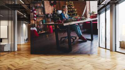 Photo of stylish classy santa show v-sign wear red christmas suit isolated on green color background Wall mural