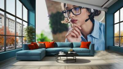 Photo of thoughtful lady specialist dressed shirt eyewear earphones hand arm chin indoors workstation workshop Wall mural