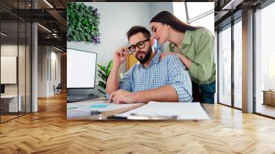 Photo of two business people girl seduce male coworker teasing in modern workstation workplace Wall mural