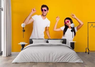 Photo of two people attend youth student party dancing like never wear cool specs and casual clothes isolated yellow color background Wall mural