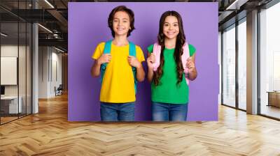 Photo of two school kids happy positive smile carry rucksack education study isolated over violet color background Wall mural