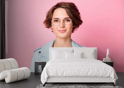 Photo of young attractive confident woman happy positive smile wear eyeglasses isolated over pink color background Wall mural