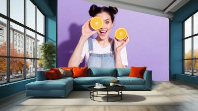 Photo of young attractive girl happy positive smile close cover eye orange fruit isolated over violet color background Wall mural