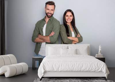 Photo of young lovely couple good mood folded hands bonding wear casual clothes isolated over grey color background Wall mural