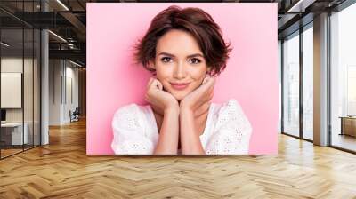 Photo portrait of adorable young woman model fists touch cheeks dreamy look wear stylish white garment isolated on pink color background Wall mural