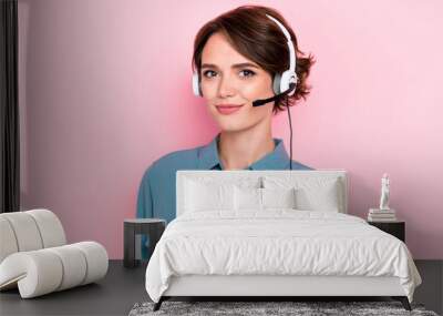 Photo portrait of attractive young lady headphones call center employee smiling wear stylish blue garment isolated on pink color background Wall mural