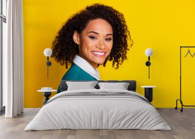 Photo portrait of attractive young woman cheerful toothy smile dressed stylish striped clothes isolated on yellow color background Wall mural