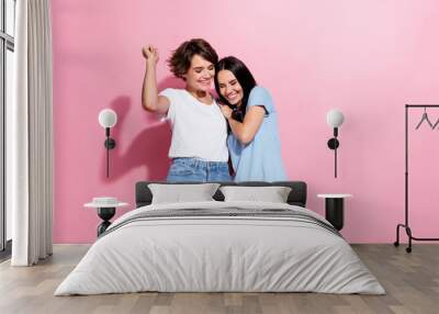 Photo portrait of funny cheerful two young funny girls positive lgbt couple love story cute relatives isolated on pink color background Wall mural