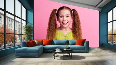 Photo portrait of lovely little girl excited reaction dressed stylish green garment isolated on pink color background Wall mural