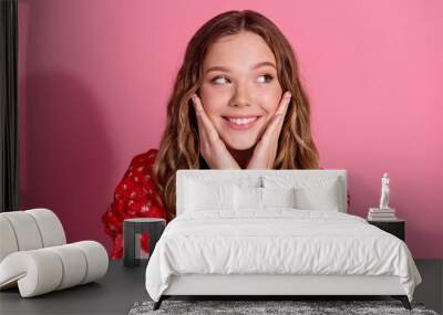 Photo portrait of lovely teen lady look dreamy empty space dressed stylish red garment isolated on pink color background Wall mural