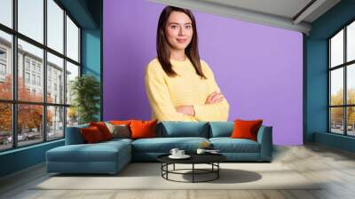 Photo portrait of serious woman with crossed arms isolated on vivid violet colored background Wall mural