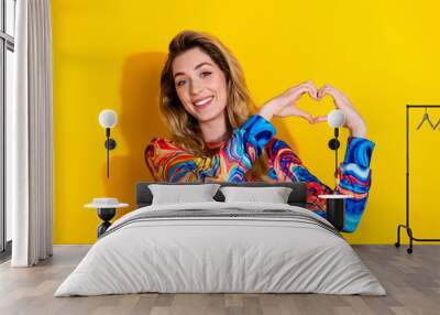 Photo portrait of young funny blonde hair stunning woman wearing colorful shirt support donation isolated on yellow color background Wall mural