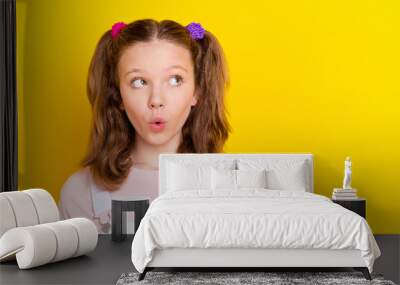 Photo portrait schoolgirl amazed in casual overall looking copyspace isolated bright yellow color background Wall mural