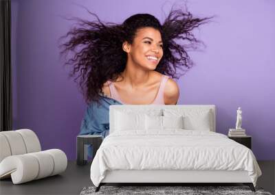 Photo portrait woman smiling with flying hair laughing dreamy isolated pastel violet color background Wall mural