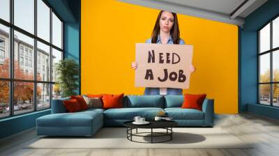 Please help me. Photo of attractive sad business lady bad mood hold carton placard jobless professional seek job work wear casual denim shirt isolated bright yellow color background Wall mural