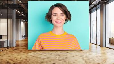 Portrait of attractive cheerful content glad brown-haired girl good mood isolated over bright teal turquoise color background Wall mural