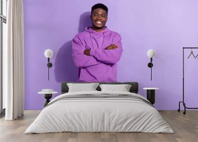 Portrait of attractive cheerful content guy folded arms wearing spring look isolated over bright violet lilac color background Wall mural