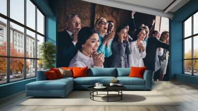 Portrait of attractive cheerful people lawyers celebrating great day workshop at loft industrial interior indoors Wall mural