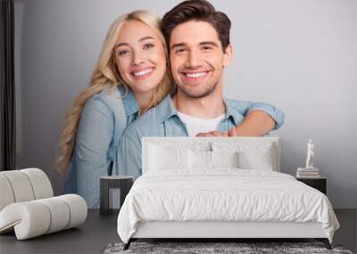 Portrait of attractive cheerful tender couple life partners hugging bonding isolated over gray pastel color background Wall mural