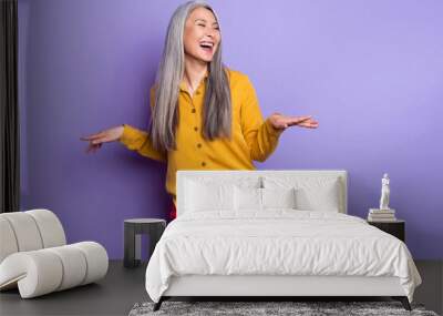 Portrait of attractive cheerful woman laughing having fun good joke isolated over bright violet purple color background Wall mural