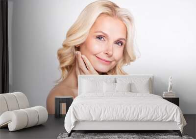 Portrait of attractive cheery healthy grey-haired woman touching face modern collagen therapy isolated over white color background Wall mural