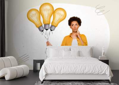 Portrait of attractive minded girl holding bunch bulbs making decision pop abstract isolated on grey white color background Wall mural