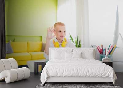 Portrait of charming adorable intelligent boy study from home modern technology indoors room apartment Wall mural