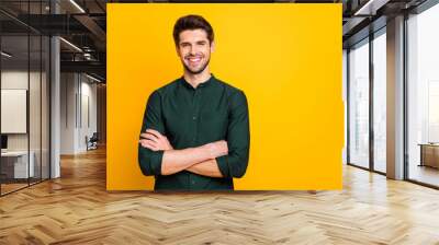 Portrait of confident cool entrepreneur guy cross hands look feel positive cheerful emotions real professional expert wear casual style clothing isolated over yellow color background Wall mural