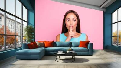 Portrait of cute model joyful teenager teen not telling secret information whisper shush dressed in colorful clothing isolated on rose-colored background Wall mural